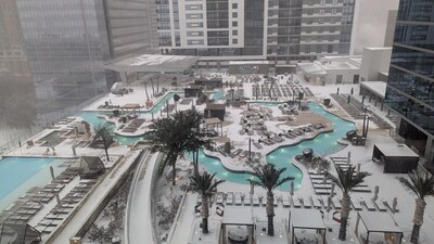 Bird's-eye view of the Marriott Marquis Houston's Texas-shaped pool in the freshly fallen snow. Bird's-eye view of the Marriott Marquis Houston's Texas-shaped pool in the freshly fallen snow.