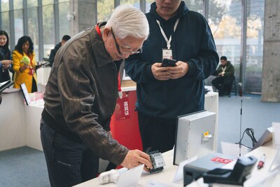 Head judge Mr. Liu Guanzhong is evaluating the shortlisted entries Head judge Mr. Liu Guanzhong is evaluating the shortlisted entries