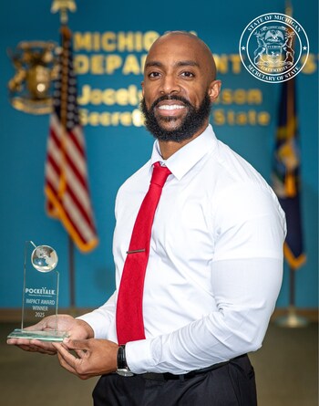 Joshua Elliott, Deputy Chief of External Affairs, accepts the Language Access Advocate Award on behalf of Secretary of State Jocelyn Benson, who is honored for leading Michigan’s charge toward true language accessibility. (PRNewsfoto/Pocketalk)