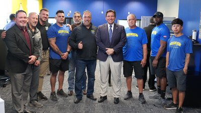 Florida Governor Ron DeSantis meets with Good Greek Moving & Storage Founder & CEO Spero Georgedakis and members of the Good Greek team at the company’s flagship West Palm Beach warehouse following the Governor’s press conference on Florida’s economic growth and migration trends. Florida Governor Ron DeSantis meets with Good Greek Moving & Storage Founder & CEO Spero Georgedakis and members of the Good Greek team at the company’s flagship West Palm Beach warehouse following the Governor’s press conference on Florida’s economic growth and migration trends.