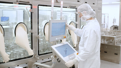 An INCOG team member monitors high-speed syringe filling activity An INCOG team member monitors high-speed syringe filling activity