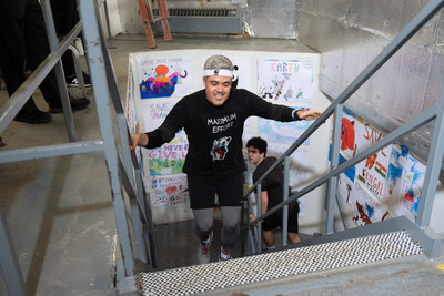 Reece David reaching the top of the CN Tower's 144 floor stairwell. © WWF-Canada (CNW Group/World Wildlife Fund Canada)