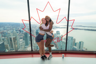 Climbers hug after reaching the top of the CN Tower © WWF-Canada (CNW Group/World Wildlife Fund Canada) Climbers hug after reaching the top of the CN Tower © WWF-Canada (CNW Group/World Wildlife Fund Canada)