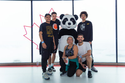 Posing at the top of the CN Tower with WWF's panda mascot. (CNW Group/World Wildlife Fund Canada) Posing at the top of the CN Tower with WWF's panda mascot. (CNW Group/World Wildlife Fund Canada)