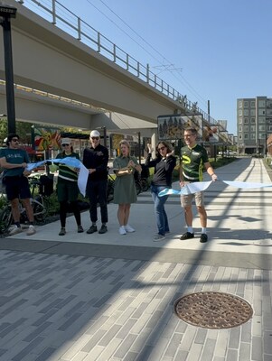 Redmond, Washington, Mayor Angela Birney joins Kevin Belle with Rails to Trails Conservancy and other regional civic leaders in September 2025 to cut the ribbon as the Redmond CentrConnector is added to the route of the Great American Rail-Trail, the organization's signature project to connect a multiuse trail across 3,700 miles between Washington, D.C., and Washington State. Photo courtesy of Rails to Trails Conservancy.