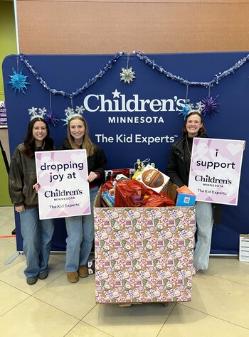 Members of the Everlight crew donate toys to Children’s Minnesota.