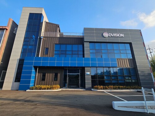 [Photo: DVISION Headquarters, South Korea] Exterior view of DVISION’s South Korea–based headquarters and manufacturing facility.