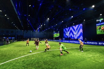 Phygital athletes competing in the physical side of Phygital Football