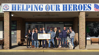 Teachers Federal Credit Union presenting the $25,000 donation to Paws of War
