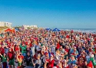Crowd at Cocoa Beach for Surfing Santas. Crowd at Cocoa Beach for Surfing Santas.