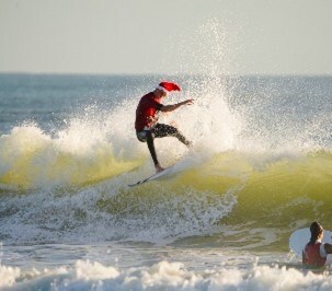Santa catches a wave. Santa catches a wave.
