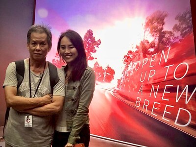 On-site at a luxury automotive launch outside a landmark retail district, 2018 — a father-daughter team behind the build, bridging legacy craftsmanship and next-generation execution.