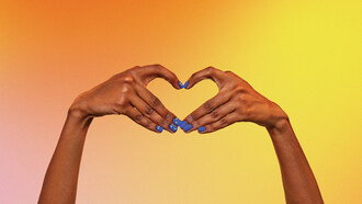 Two hands are held together in the shape of a heart. Each fingernail is painted bright blue and decorated with white raised braille dots. (CNW Group/Canadian National Institute for the Blind)