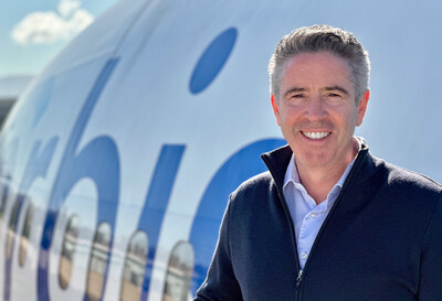 John Slattery, newly appointed Chair of the Board of Directors for Orbis International, pictured outside the Flying Eye Hospital, a unique aircraft delivering sight-saving care worldwide.