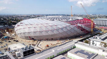 Intuit Dome in Inglewood during construction, showing the arena’s distinctive oval form. The project reflects One Baker’s role in delivering integrated clean energy and electrical solutions.