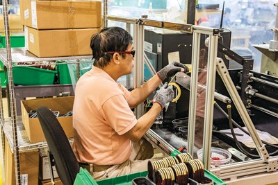 A Garrett employee in their Garland, Texas manufacturing facility. A Garrett employee in their Garland, Texas manufacturing facility.