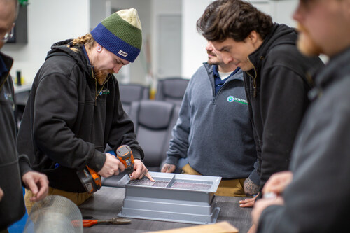 Interstate Pest Management Technicians learning exclusion tactics at a Continuing Education Class
