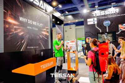 Wingsuit pilot Jamie shares his “Courage Charge” story with a captivated audience at the TESSAN CES booth, bringing the “Why Do We Fly” narrative to life.