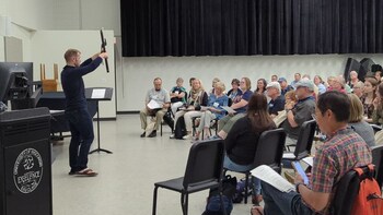 Jonny Lipford teaching an in-person flute class on songwriting