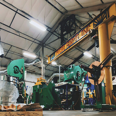 Interior of the Micro Forms manufacturing facility in Garland, Texas, showing precision metal stamping presses and production equipment used to manufacture tight-tolerance components with custom tooling.