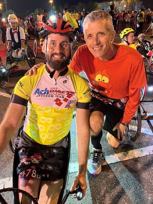 David M. Cordani, The Cigna Group Chairman and Chief Executive Officer, poses with Stefan LeRoy, Achilles Freedom Team athlete and retired U.S. Army Sergeant, while participating in the 2026 Walt Disney World(r) Marathon Weekend.