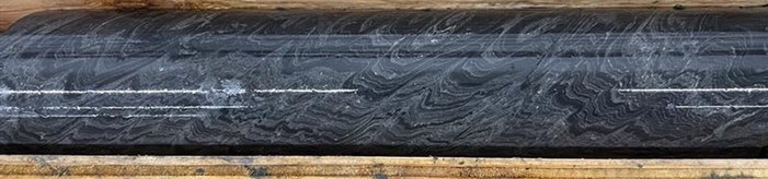 Photo 1: Selected interval of Black Facies mineralization in TS25-003 laminated sphalerite, barite, and mudstone at 1,198 m. (CNW Group/Fireweed Metals Corp.) Photo 1: Selected interval of Black Facies mineralization in TS25-003 laminated sphalerite, barite, and mudstone at 1,198 m. (CNW Group/Fireweed Metals Corp.)