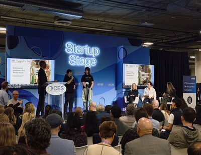 Lingfei Li, Founder & CEO of MyMemo AI, presenting MyMemo ONE on the CTA Foundation Startup Stage at CES 2026, demonstrating the humanoid robot’s AI memory, emotional guidance, and senior care capabilities.