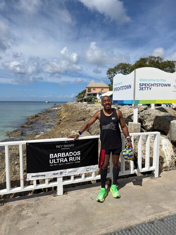 Rey on Speightstown Jetty after running over 100km around Barbardos