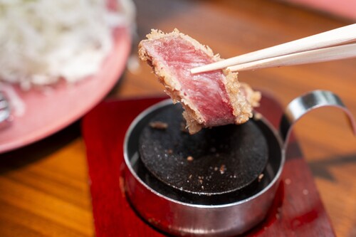 Interactive Dining Experience: Guests can grill their premium WAGYU beef katsu to their preferred doneness on a sizzling hot stone.