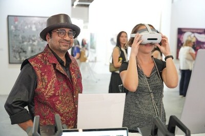 Art enthusiasts explore digital exhibitions of the CGTN Art Series at ART SG in Singapore, January 23, 2026. /CGTN (PRNewsfoto/CGTN)