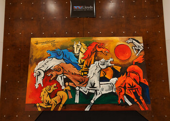 M.F. Husain, Horses (2006), Acrylic on Canvas, 97 x 60 in; a monumental composition of bold, angular forms and striking colors capturing the raw power of horses charging beyond the frame.