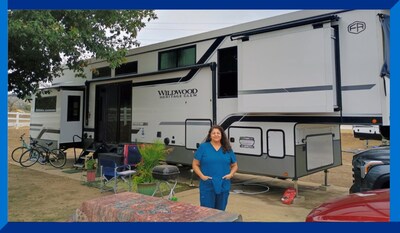 Patricia, a program participant, stands in front of her new RV. (Photo Credit: Jody Guerra, Episcopal Diocese of West Texas)