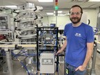 Ellis Cassity, Manufacturing Engineer at PDS Optical, stands beside his latest invention, the Perfect Drying System.