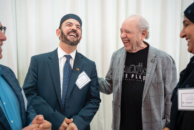Philanthropist Alan Ginsburg and Imam Muhammad Musri sharing a moment of connection at last year's Central Florida Pledge Leadership Summit. Philanthropist Alan Ginsburg and Imam Muhammad Musri sharing a moment of connection at last year's Central Florida Pledge Leadership Summit.