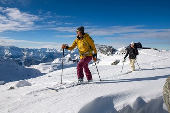 Guests explore the Alps on a guided backcountry ski tour