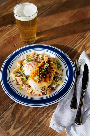 Chicken Fat Fried Rice with Thai-glazed chicken breast, poached egg, chicharrón furikake, and scallions, featured the week of February 2. Photo by Sarah Anne Risk.