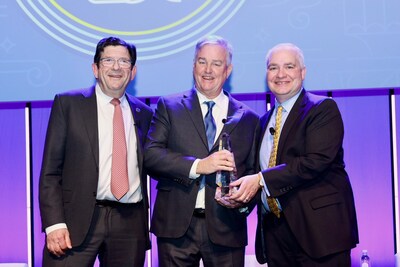 David Trone (center), Owner and Founder of Total Wine & More accepts Ray Herrmann H.E.R.O. Award from Charlie Merinoff, Breakthru Beverage (left) and Francis Creighton, WSWA (right).
