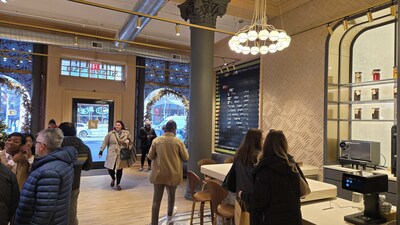 The custom-branded split-flap display designed and built for Nespresso is now placed in the retail flagship near the entrance. The split-flap board rotates through brand imagery, such as the Nespresso logo, using custom-colored flaps.