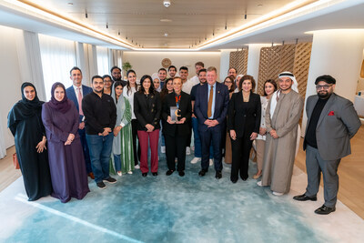 Lonnie Ali holding a Community Connect award presented from the American University of Sharjah (Photos Courtesy of Muhammad Ali Center and the American University of Sharjah)