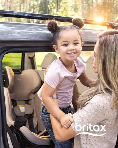 A caregiver lifts a child in and out of the Britax Galaxy360™ slim rotating convertible car seat, designed to support easier, more ergonomic loading and unloading with effortless one-hand 360° rotation.
