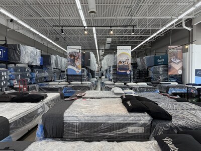 Inside a National Mattress showroom, where customers can test and compare over 5,000 mattresses from 14+ leading brands - including Sealy, Serta, Beautyrest, and Tempur-Pedic - side by side before buying.