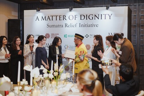 Symbolic handover as KuCoin and the Global CSR Foundation present relief packages to H. Teuku Badruddin Syah, Sultan of Aceh, alongside Yayasan Srikandi Merah Putih, marking the launch of the A Matter of Dignity Sumatra Relief Initiative.