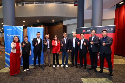 DBS Group CEO Tan Su Shan (centre in red) and Forest Lin (fifth from right), Corporate Vice President of Tencent and Head of Tencent Financial Technology, signed an MOU to enhance mutual cross-border payment connectivity at the Singapore FinTech Festival 2025.