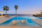 Private oceanfront luxury villa with infinity pool at sunset, reflecting the growing preference among ultra-high-net-worth travelers for secluded European estate stays.