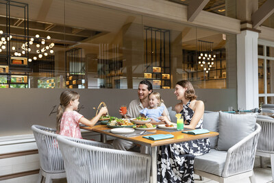 Family enjoying 'Kids eat free' at Phuket Eatery— Courtyard by Marriott Phuket, Patong Beach Resort