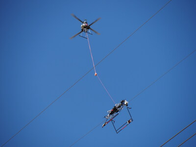 FulcrumAir's LineFly™ robotic system installing PLP BIRD-FLIGHT™ Diverters on overhead power lines.