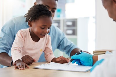 Child looking at medical chart in a hospital.