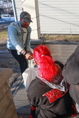 DigitalC Chief Executive Officer Joshua Edmonds delivers a subscriber appreciation bag and announces a fully paid year of service to a Cleveland household on Feb. 16 during the company’s 8,216th installation.