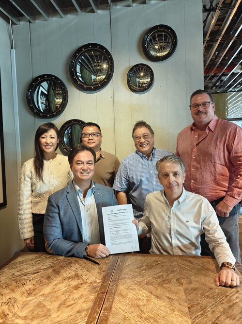 Representatives of Aligned Energy and Phi Earth Technologies following the signing of a non-binding MOU in Singapore to launch a structured pilot evaluating scalable biofuel feedstock systems.