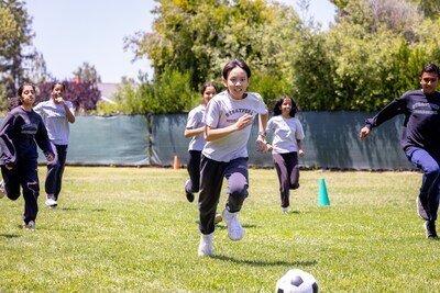 Students take part in sports, such as soccer.